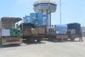 Quelques camions contenant les stocks de produits alimentaires de l’Oprag pour la banque alimentaire, le 23 avril 2020 à Owendo. © Gabonreview