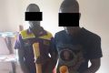 Deux membres du trio de présumés trafiquants après leur arrestation, le 10 février 2021 à Bitam. © D.R.