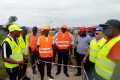La délégation de SEEG sur un des sites d’exécution des travaux de renforcement, d’extension et de sécurisation du réseau d’électricité et d’eau potable du Grand Libreviell. ©SEEG