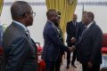Le ministre de l'Économie Mays Mouissi Kinga saluant le président ivoirien, le 11 avril 2924 à Abidjan. © Présidence RCI