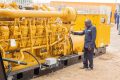 Le ministre Tonangoye inspectant un des groupes électrogènes, lors de la livraison. © D.R.
