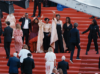 Sur le tapis rouge de Cannes, l'équipe de Ben'Imana, entre Gabon et Rwanda, salue un monde qui vient de les découvrir. © GabonReview (capture d’écran)