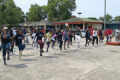 Employés, partenaires et invités de NLS à l'unisson lors de la séance de fitness, le samedi 18 juillet, à la foire municipale Pierre Louis Agondjo Okawé de Port-Gentil. © GabonReview