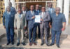 Le ministre de la Justice, Garde des Sceaux, Augustin Emane, recevant le document des mains du président de la Commission, César Apollinaire Ondo Mvé, accompagné des membres. © D.R.