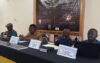 L’auteur (en ensemble marron), le préfacier et le critique, lors de la cérémonie de présentation du livre, le 8 aout 20263, à Libreville. © GabonReview