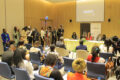 La styliste Doriane Lee Cooper Taty (en rouge), les autres membres de l’organisation face au ministre de la Culture, Paul Ulrich Kessany, à la Commissaire générale aux expositions du Gabon, Nina Alida Abouna, et aux journalistes. © GabonReview
